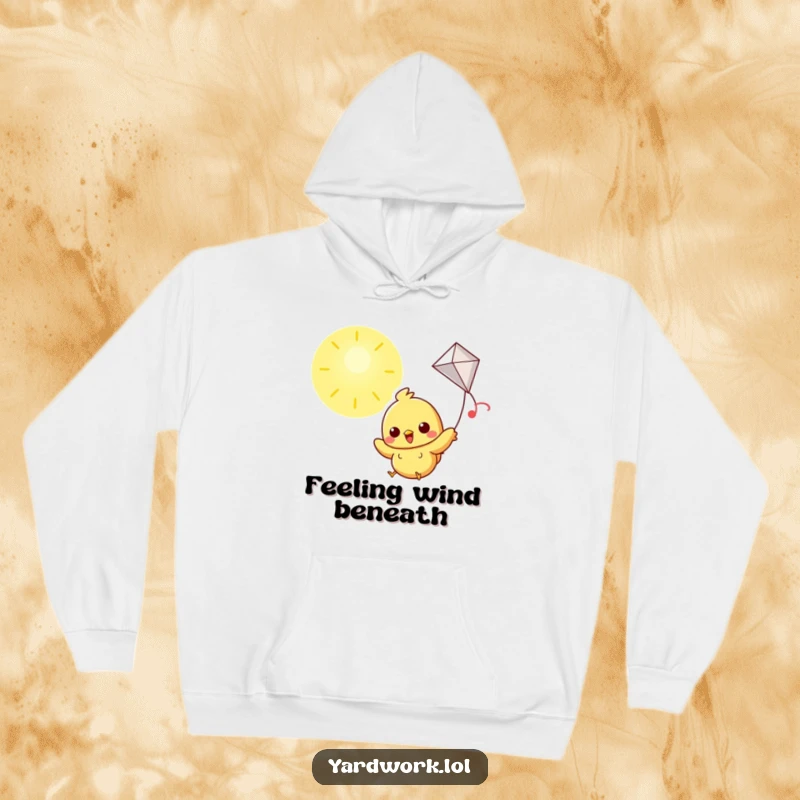 Funny hoodie with a cheerful chick flying a kite at high altitudes in a sunny sky.