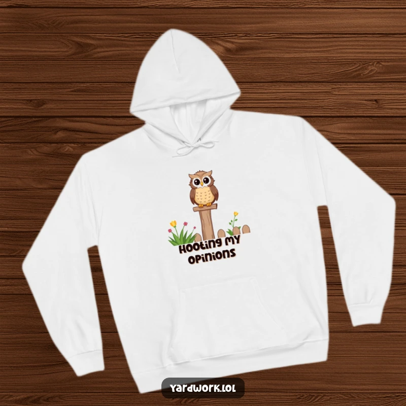 Funny hoodie featuring a wise, content owl perched on a fence post, overlooking a peaceful garden scene. Cozy and humorous.