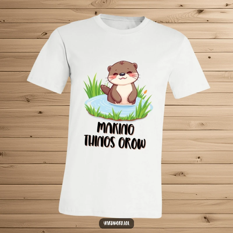 Funny t-shirt featuring a playful otter using a watering can to water lush green grass. Whimsical and charming design.